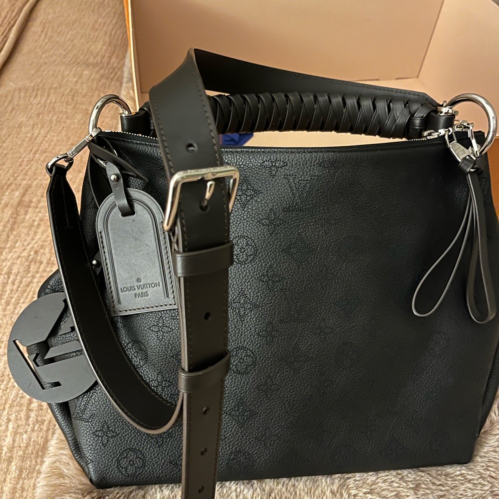 Louis Vuitton Beaubourg Hobo MM bag in Marina Calf Leather, braided handle.